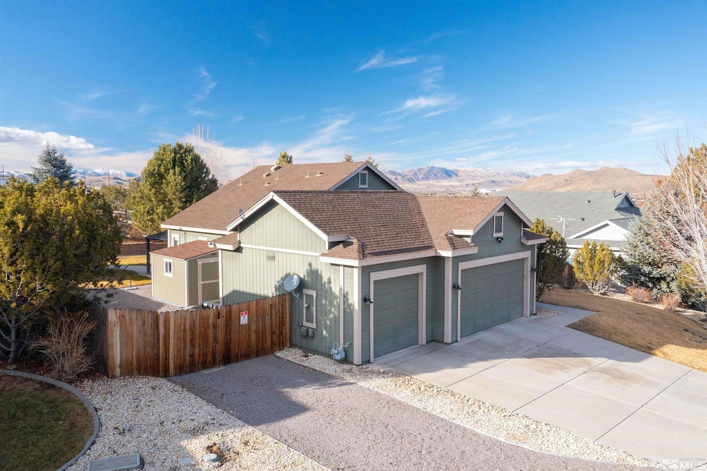 view of front of house with a mountain view and a garage