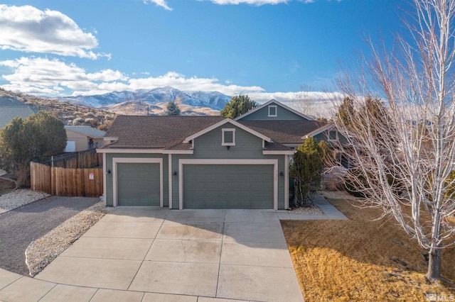 view of front of home featuring a mountain view and a garage