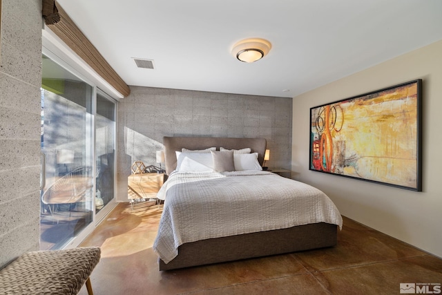 bedroom featuring concrete floors