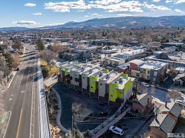 birds eye view of property featuring a mountain view