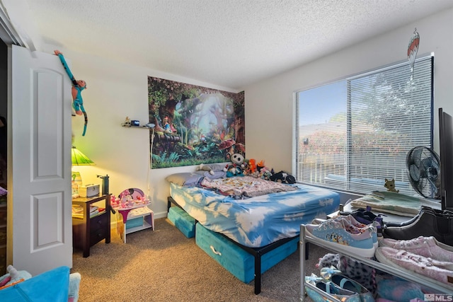 bedroom with carpet and a textured ceiling