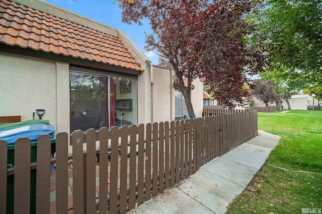 view of home's exterior with a yard