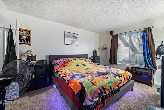 bedroom featuring a textured ceiling and carpet floors