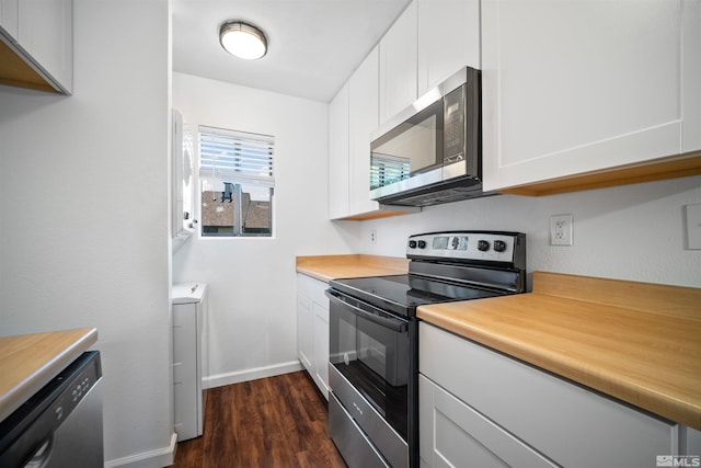 kitchen with white cabinets, stainless steel appliances, and dark hardwood / wood-style floors