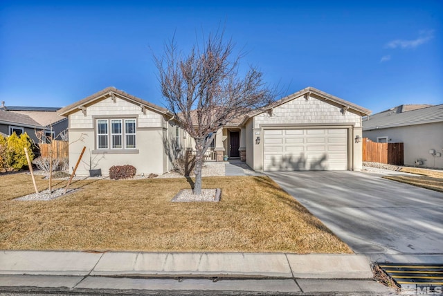 ranch-style home featuring a garage and a front lawn