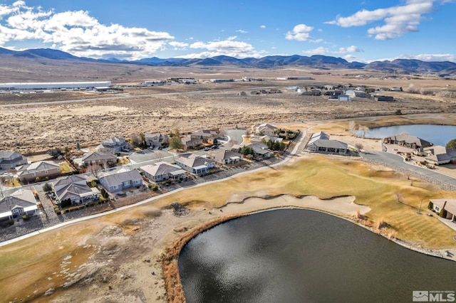 birds eye view of property featuring a water and mountain view