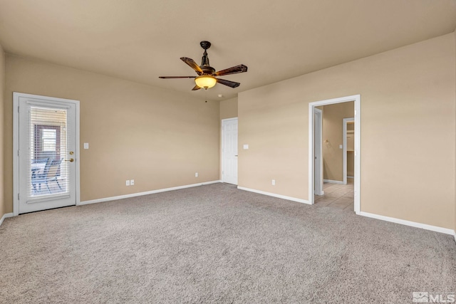 empty room featuring carpet and ceiling fan