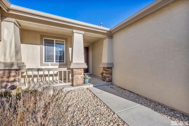 property entrance featuring covered porch