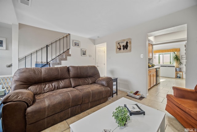 living room with light tile patterned floors