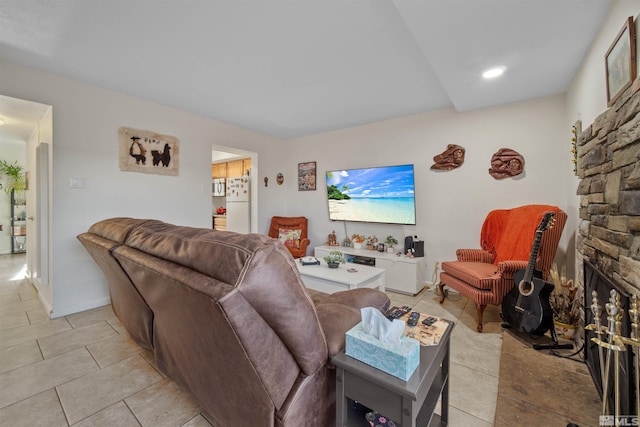 tiled living room with a fireplace