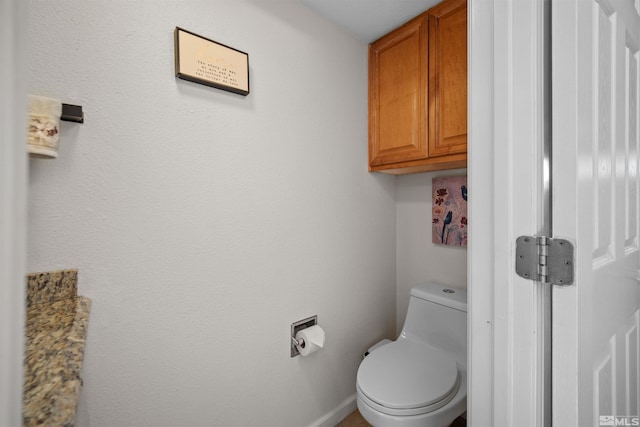 bathroom featuring toilet