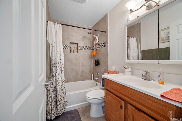 full bathroom featuring a textured ceiling, vanity, shower / bath combo with shower curtain, tile patterned flooring, and toilet