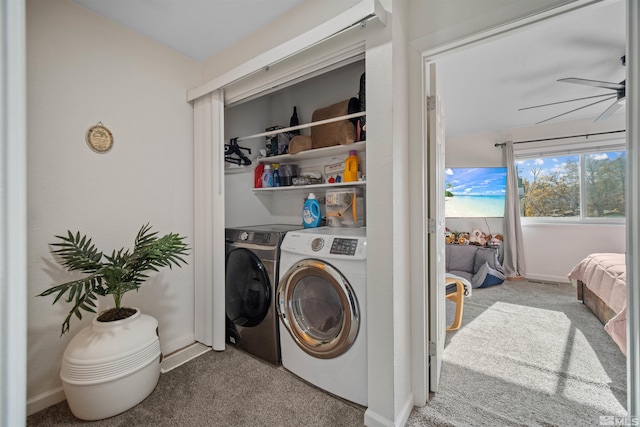 washroom with ceiling fan, light colored carpet, and washing machine and clothes dryer