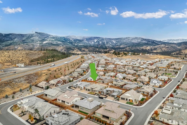 drone / aerial view with a residential view and a mountain view