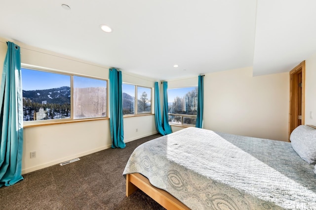 carpeted bedroom featuring a mountain view