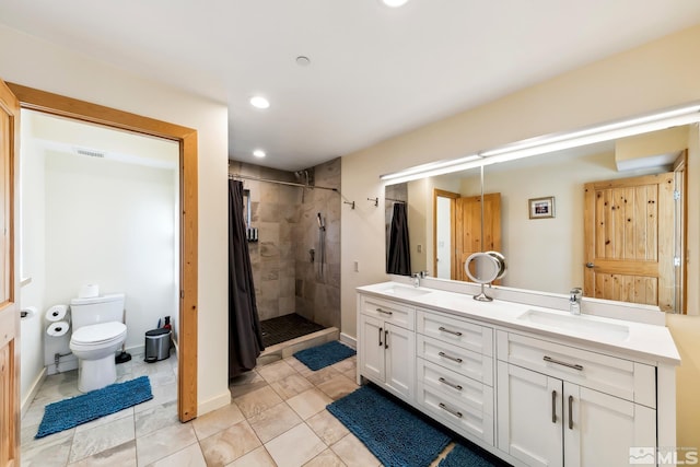 bathroom with toilet, tile patterned flooring, vanity, and a shower with shower curtain