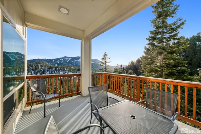 wooden deck featuring a mountain view