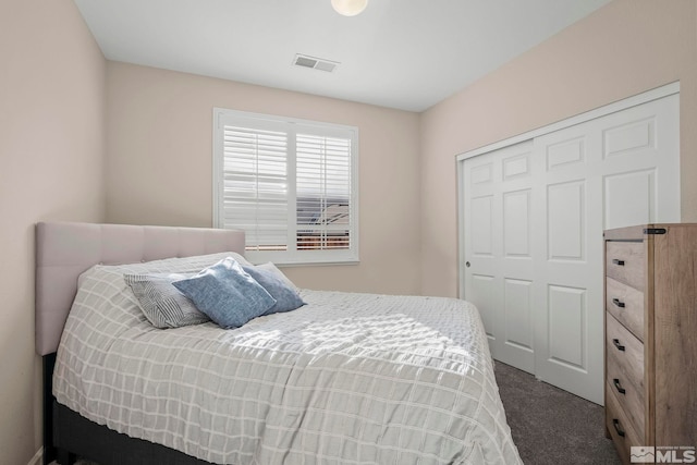 carpeted bedroom featuring a closet