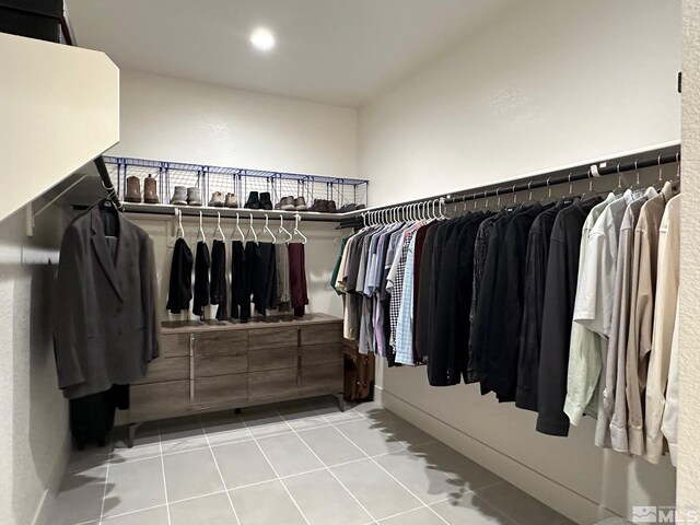 walk in closet featuring light tile patterned floors