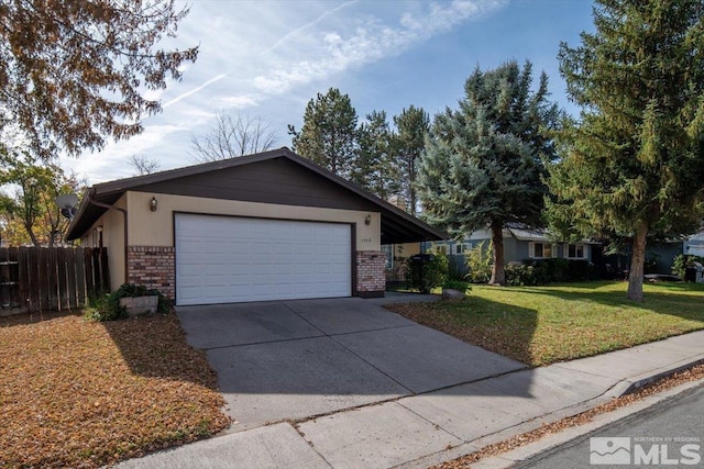 ranch-style house with a garage and a front lawn