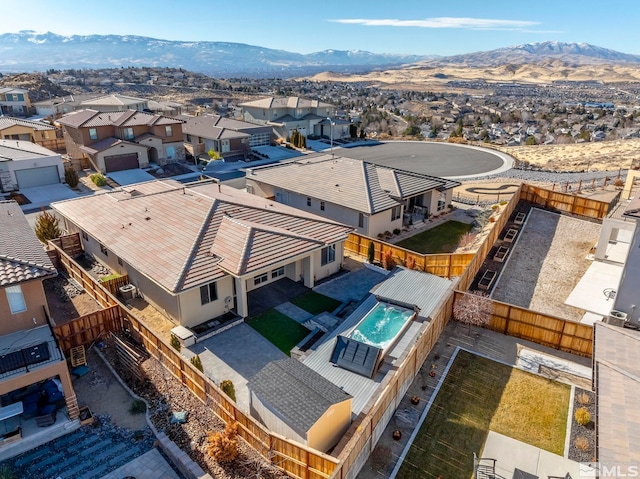 birds eye view of property featuring a mountain view