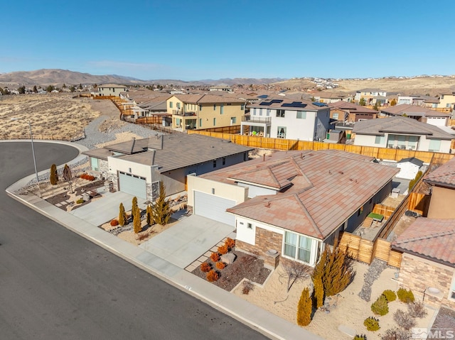 birds eye view of property with a mountain view