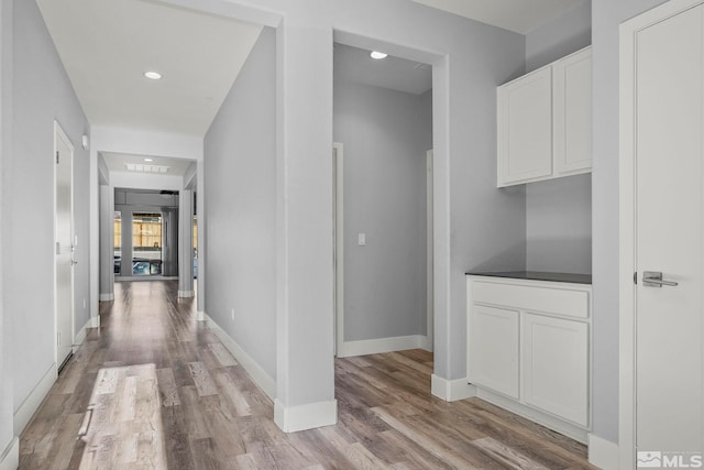 corridor featuring light hardwood / wood-style floors