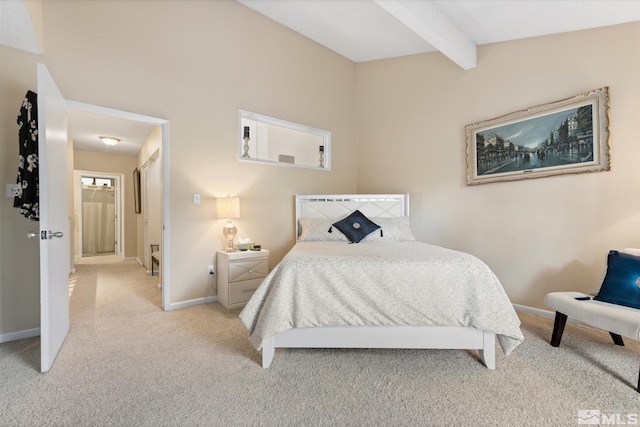 bedroom featuring lofted ceiling with beams and light colored carpet