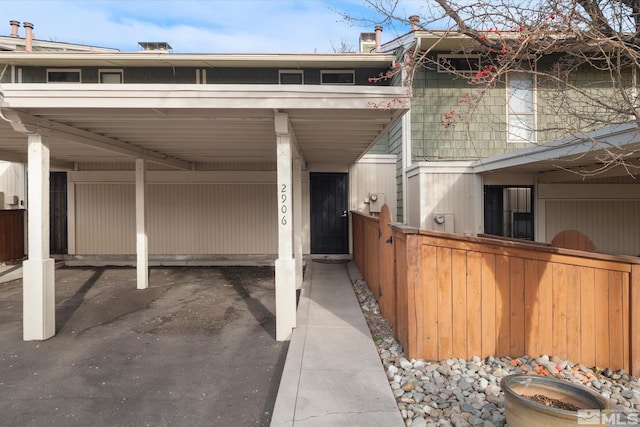 exterior space featuring a carport