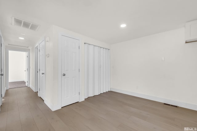 hall with light wood-type flooring