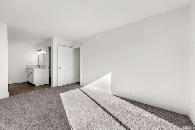 bedroom featuring carpet floors and sink