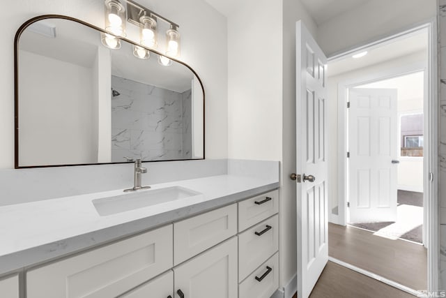 bathroom featuring hardwood / wood-style floors and vanity