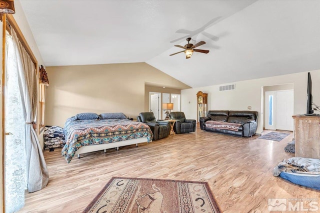 bedroom with light wood-type flooring, ceiling fan, and lofted ceiling