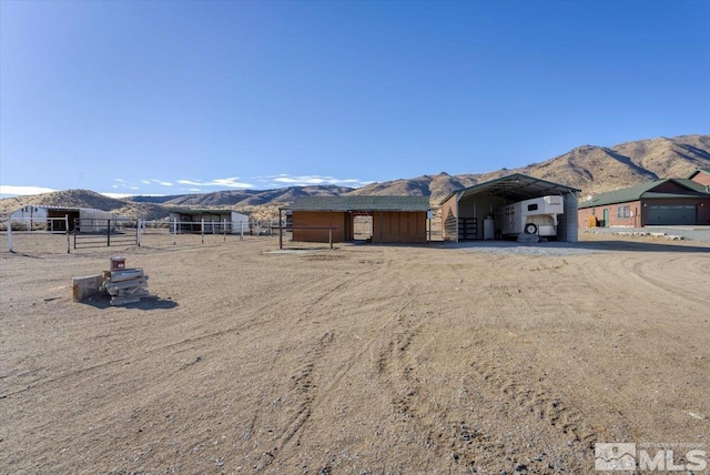 ranch-style home with a mountain view and a carport