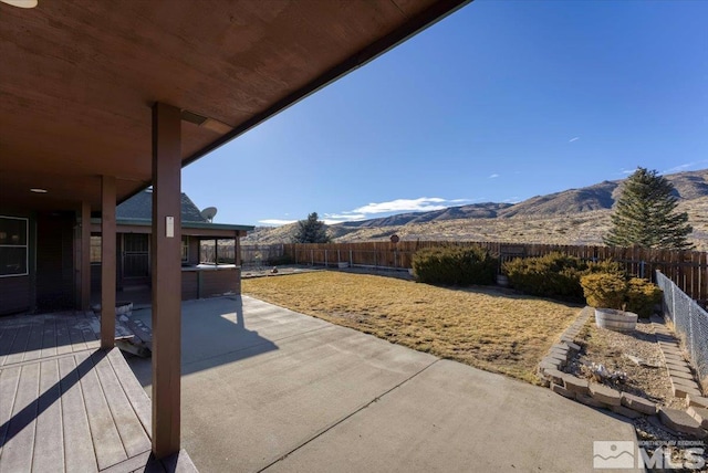 view of patio / terrace with a mountain view