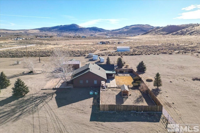 birds eye view of property featuring a mountain view