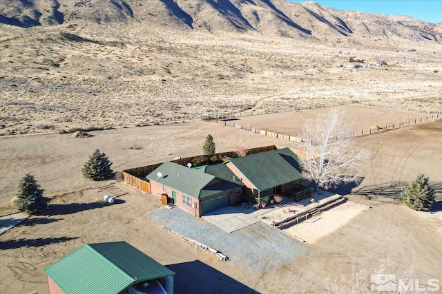 birds eye view of property featuring a mountain view