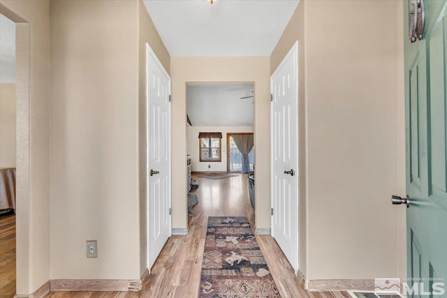 corridor featuring light hardwood / wood-style flooring