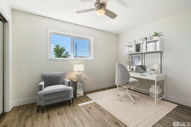 office area with ceiling fan and wood-type flooring