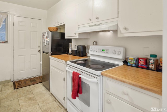 kitchen featuring white cabinets, stainless steel fridge, and white electric stove