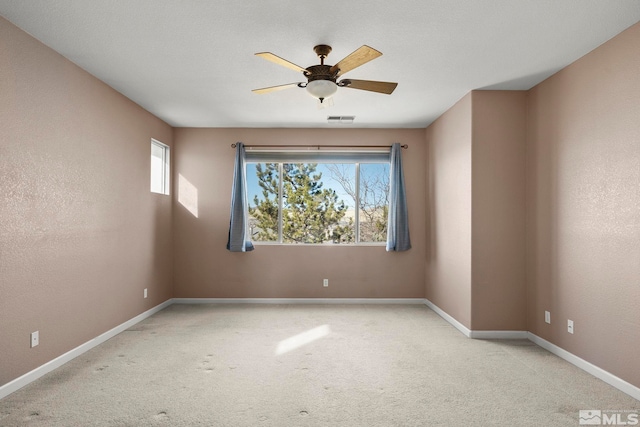 unfurnished room with light carpet and ceiling fan