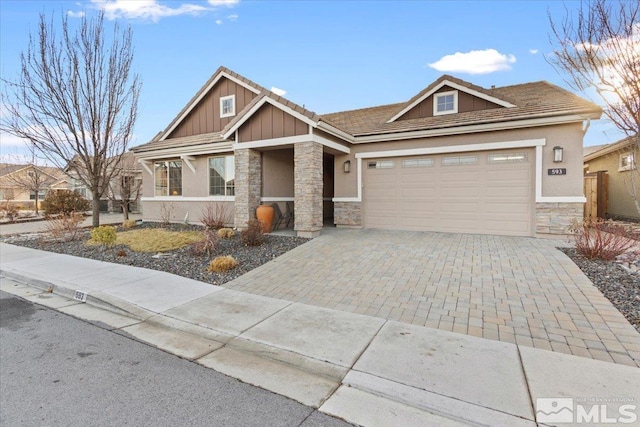 craftsman house with a garage