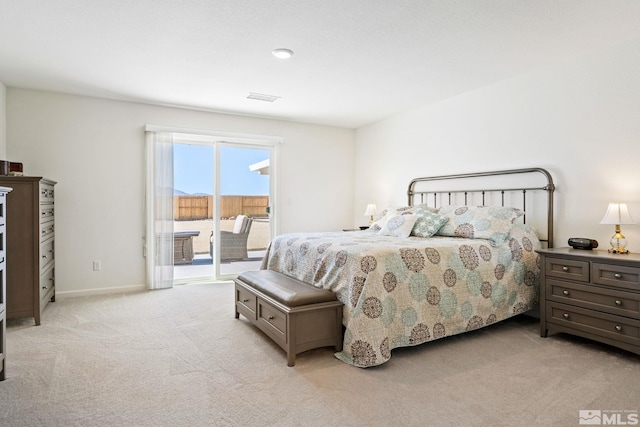 carpeted bedroom with access to exterior