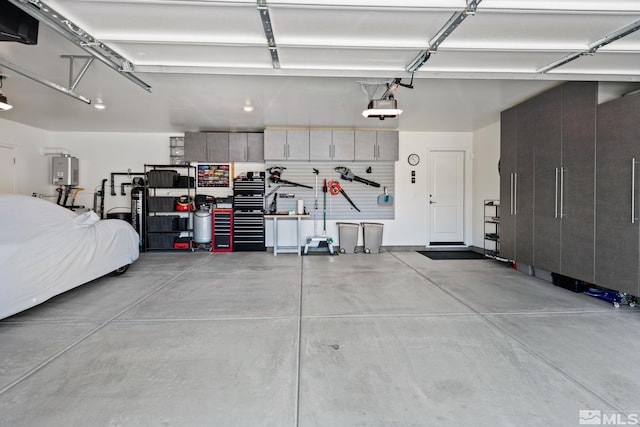 garage with a garage door opener and water heater