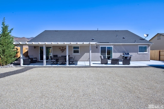 rear view of house with an outdoor hangout area and a patio