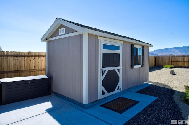 view of outbuilding featuring a mountain view