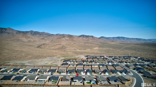 drone / aerial view featuring a mountain view