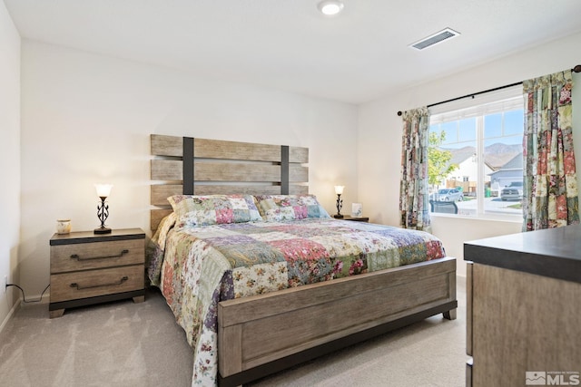 bedroom with light carpet