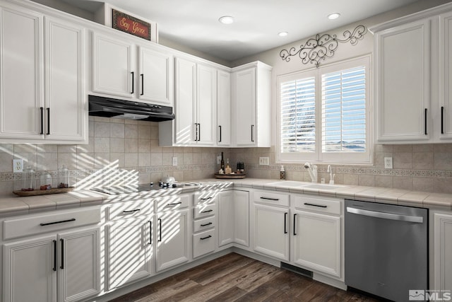 kitchen with dark hardwood / wood-style flooring, stainless steel dishwasher, sink, tile countertops, and white cabinetry