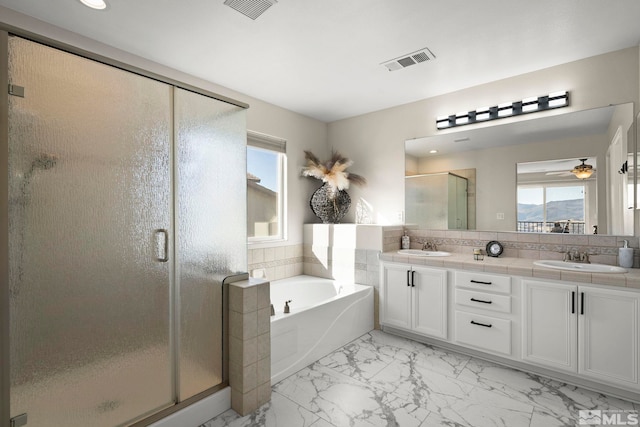 bathroom featuring decorative backsplash, shower with separate bathtub, vanity, and ceiling fan